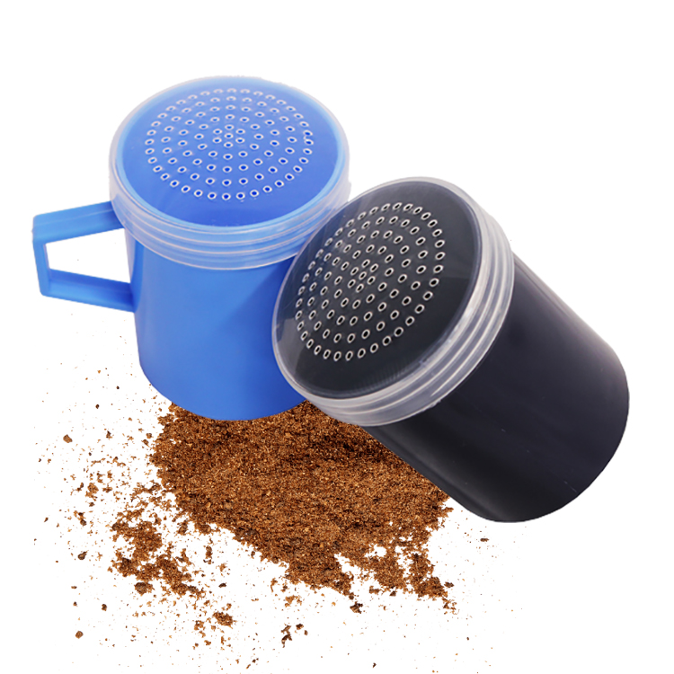 Two plastic spice shakers in blue and black with spices spread around them, designed for easy and mess-free seasoning